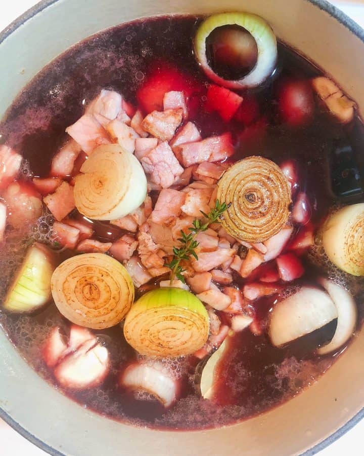 Coq au vin cooking in pot