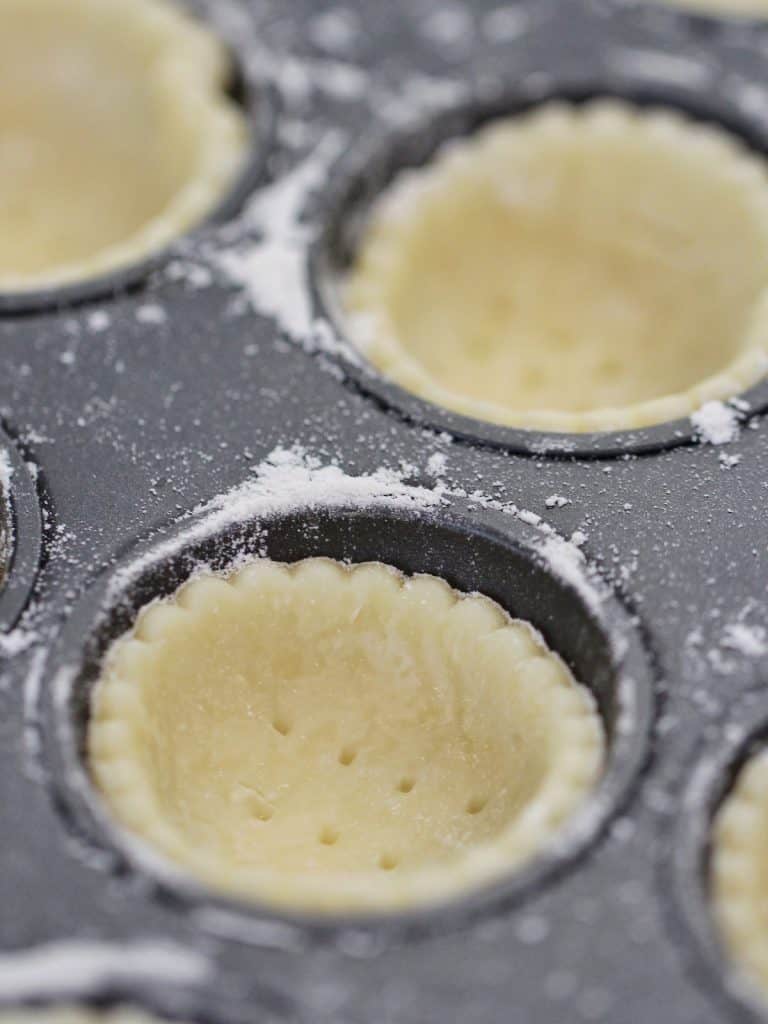 Pastry cases in muffin tin for lemon meringue tarts
