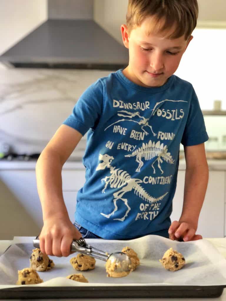 Using cookie scoop to make chocolate chip cookies