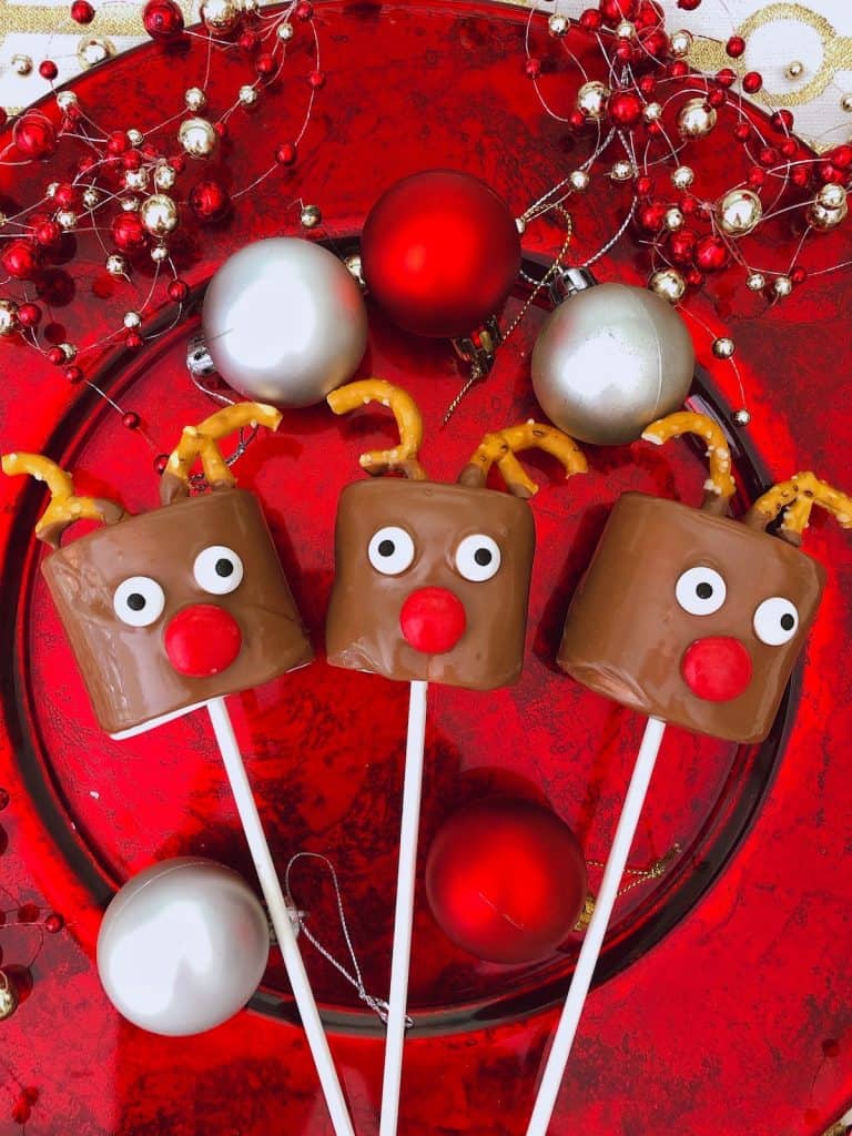 a plate of reindeer marshmallows with Christmas balls 