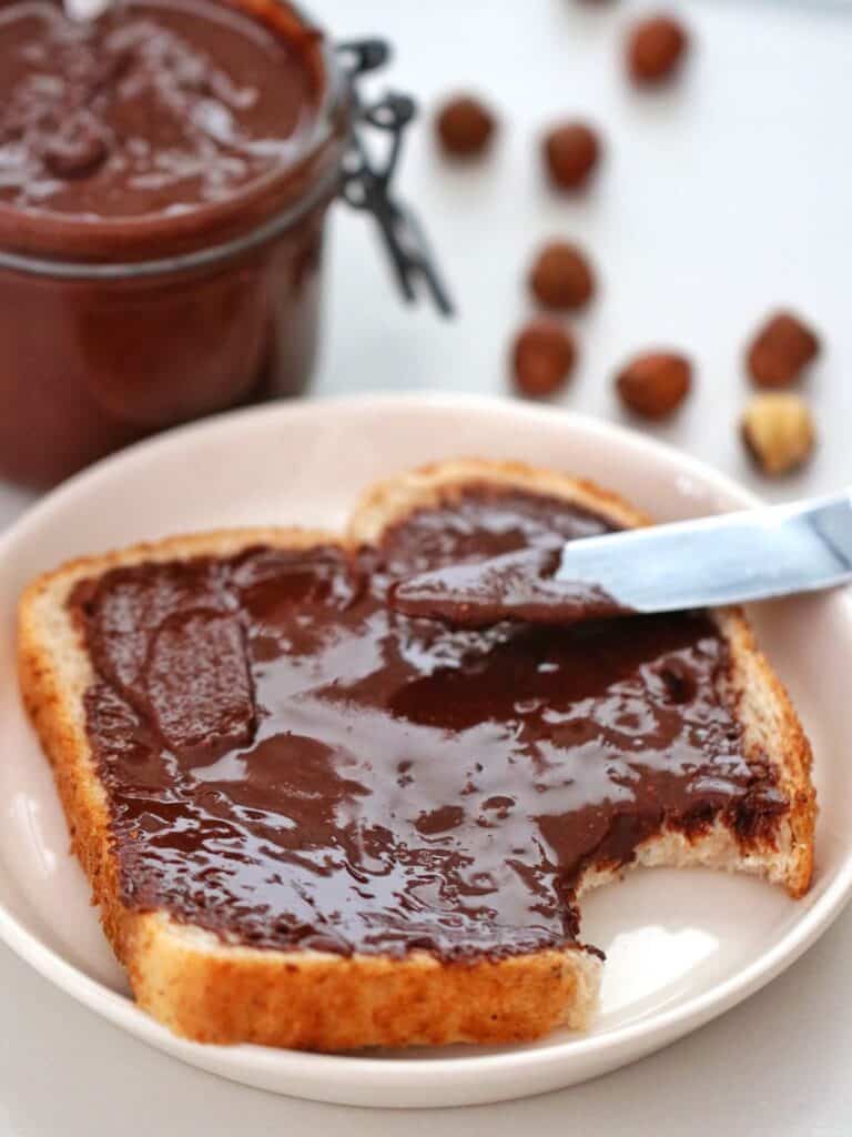 Homemade Thermomix Nutella on bread with a bite taken out