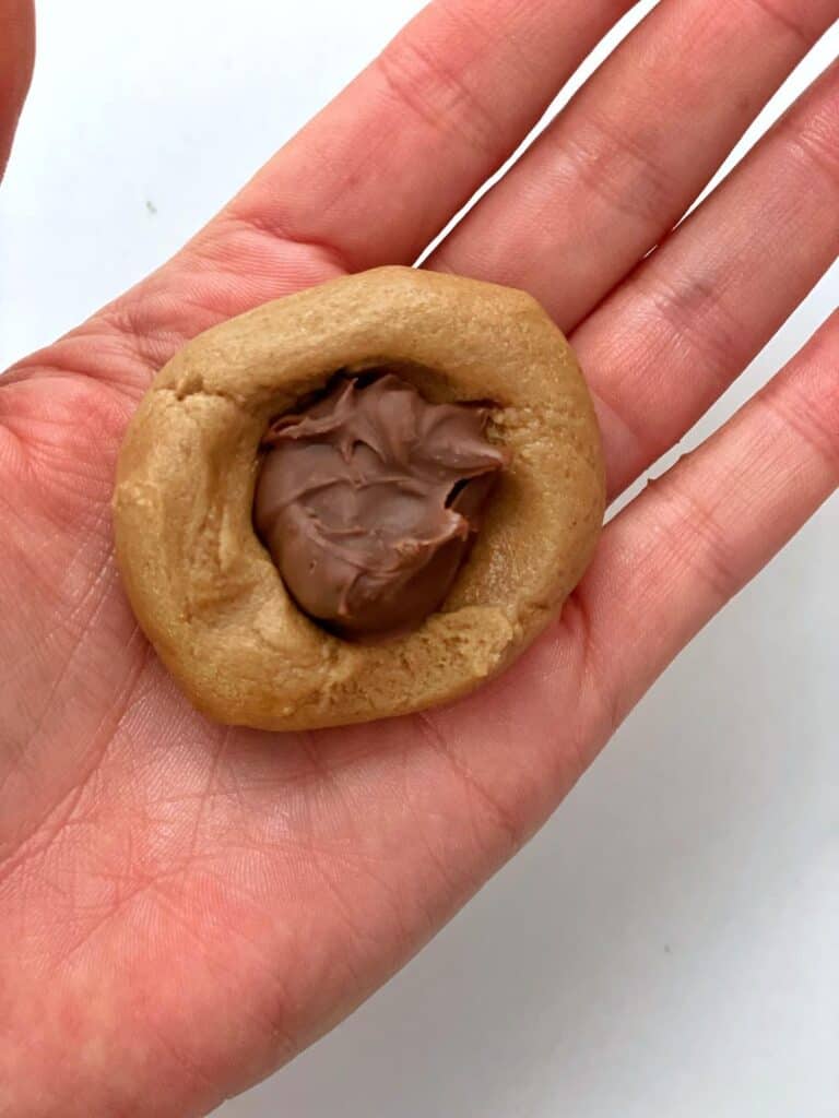 Cookie dough with frozen Nutella inside for nutella cookies