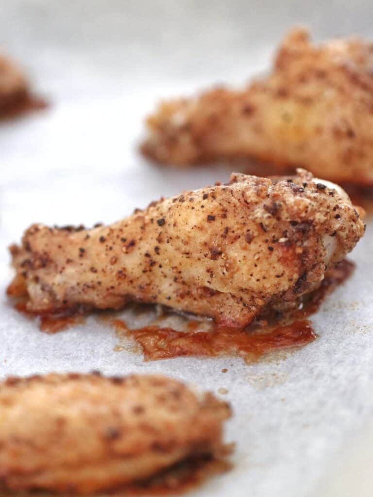 Roasted chicken wings on baking tray