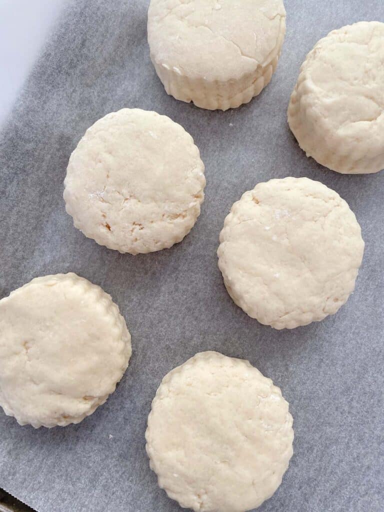 lined scones dough in baking paper.