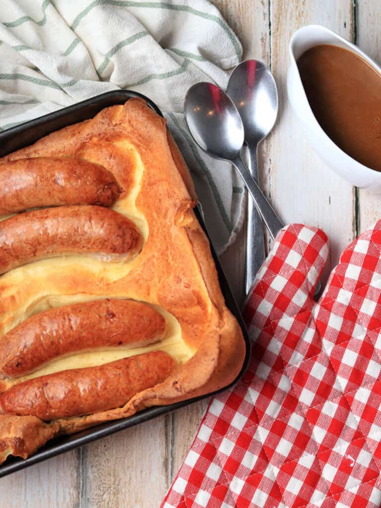Thermomix Toad in the Hole on table with gravy jug
