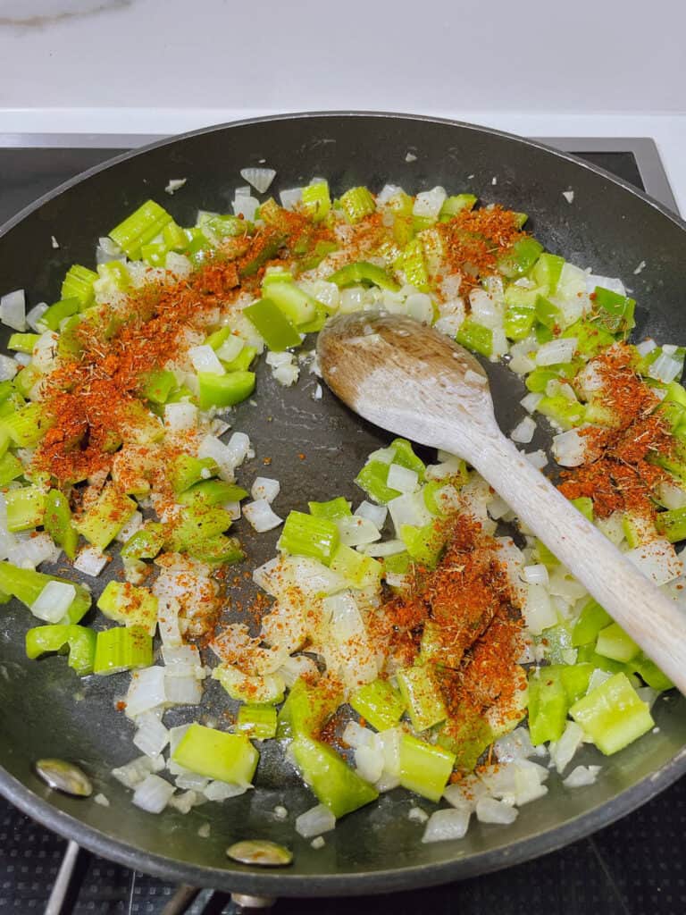 melted butter with saute onion and celery Cajun seasoning