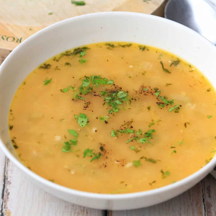 Leftover chicken soup in a bowl