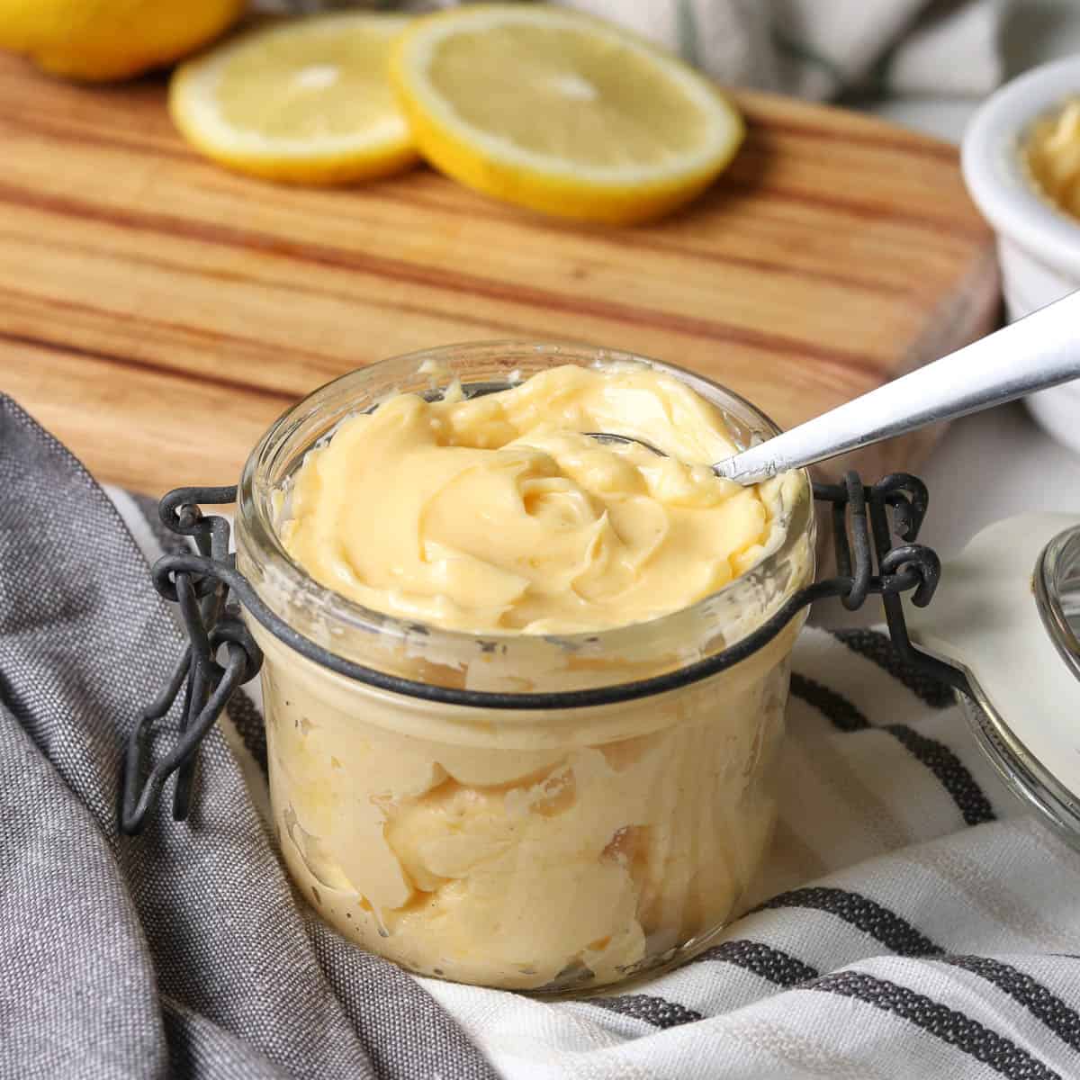 Thermomix Mayonnaise in a jar with a spoon.