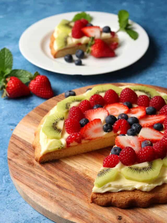 Thermomix fruit pizza with slice cut out.
