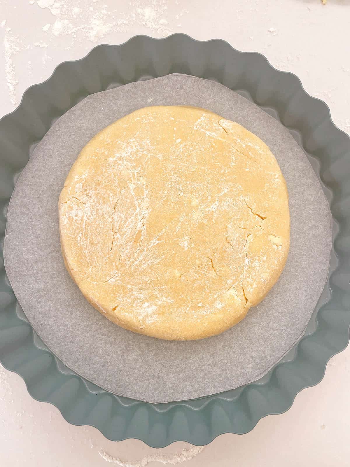 Cookie dough disc in tart tin.
