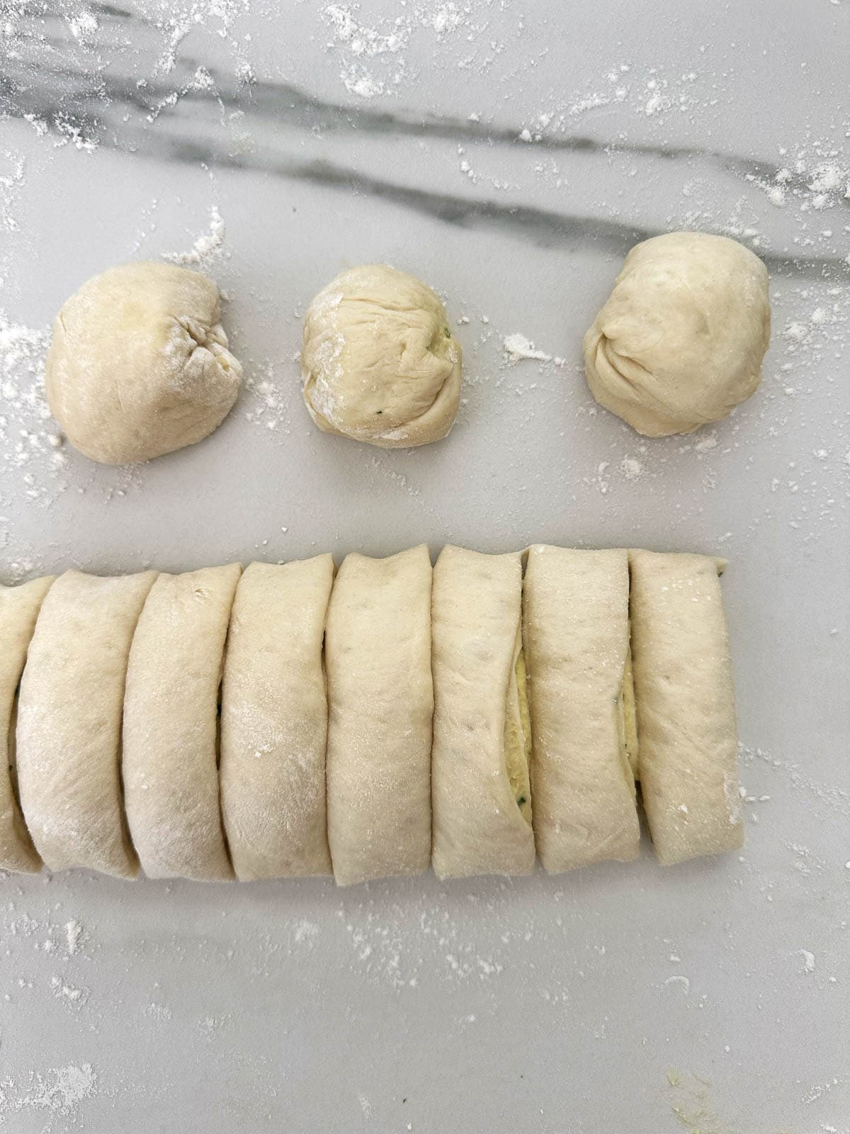 Thermomix garlic bread dough cut into equal portions. 
