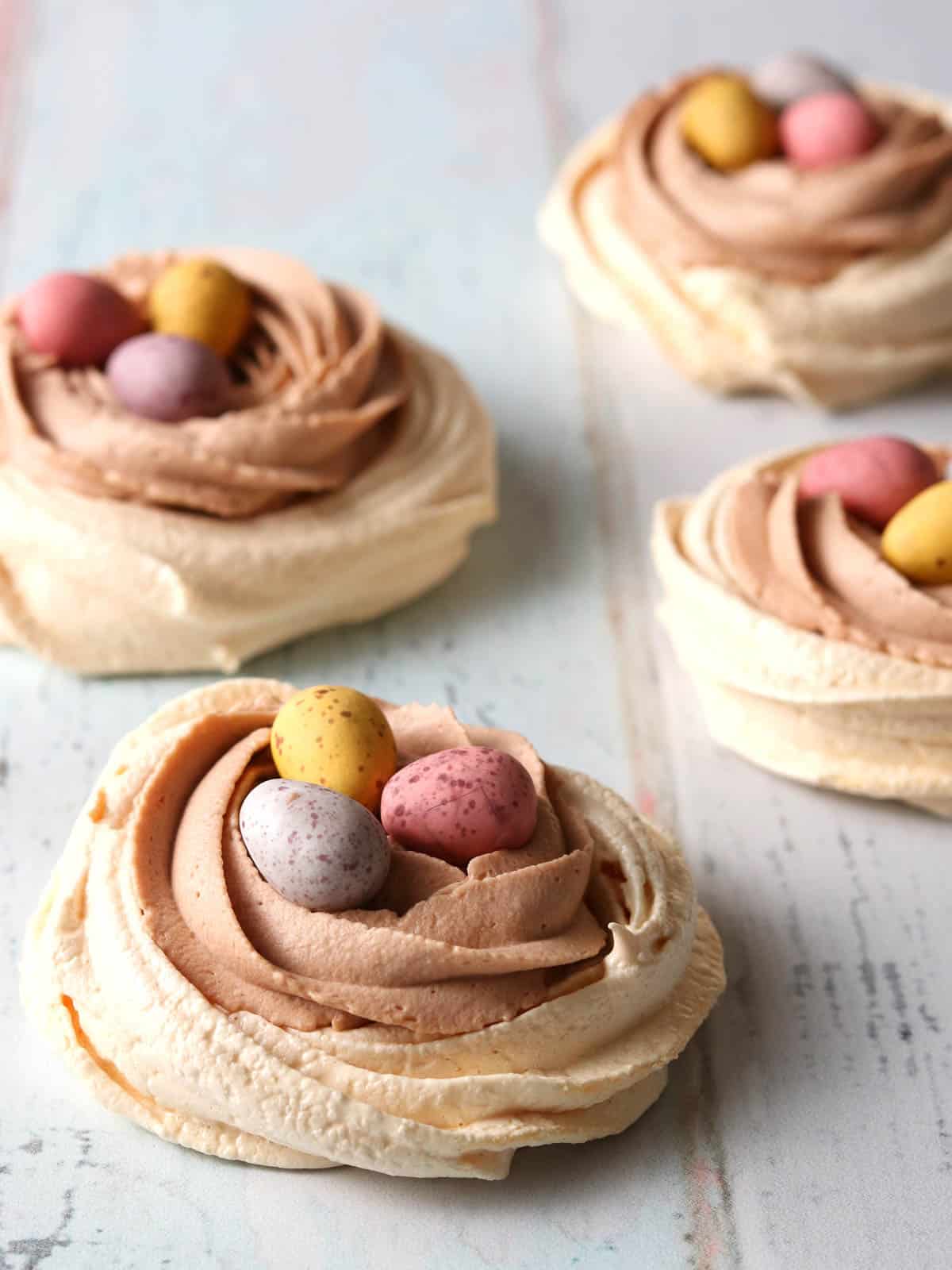 Easter Meringue Nests topped with mini eggs.