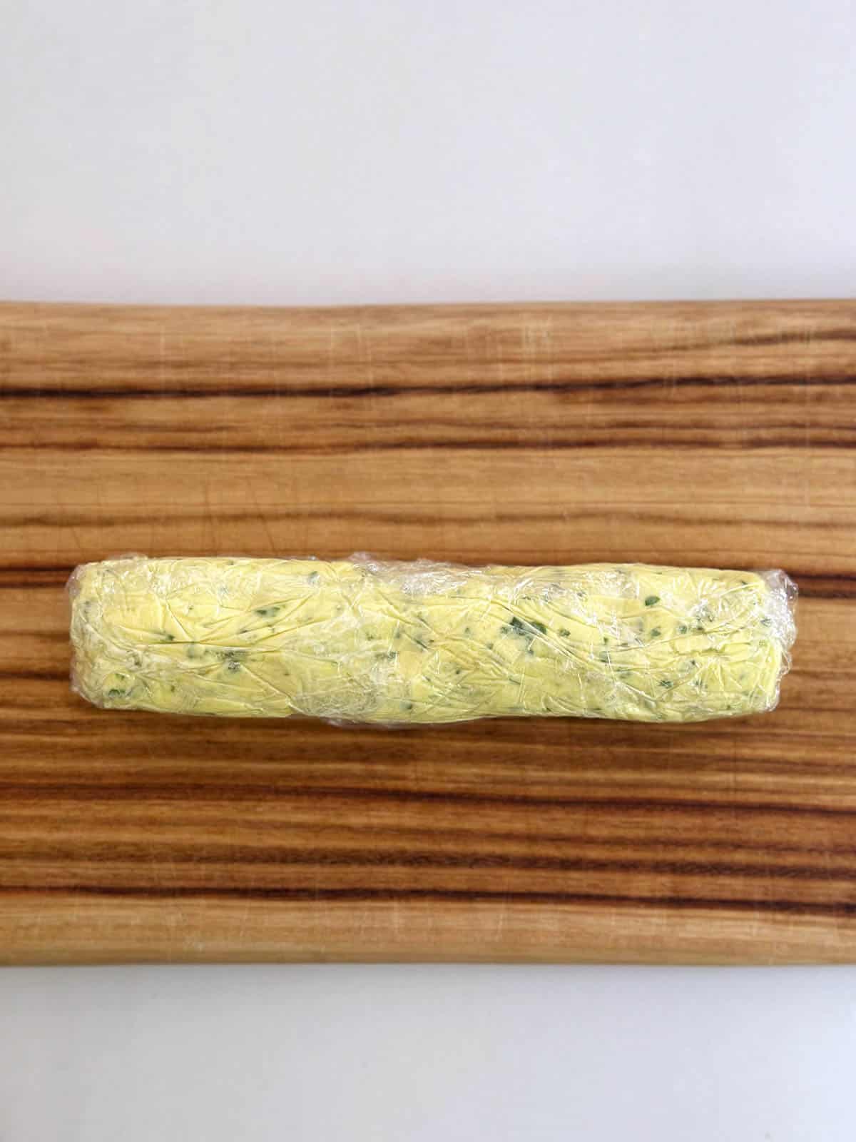 Garlic butter rolled in cling film.