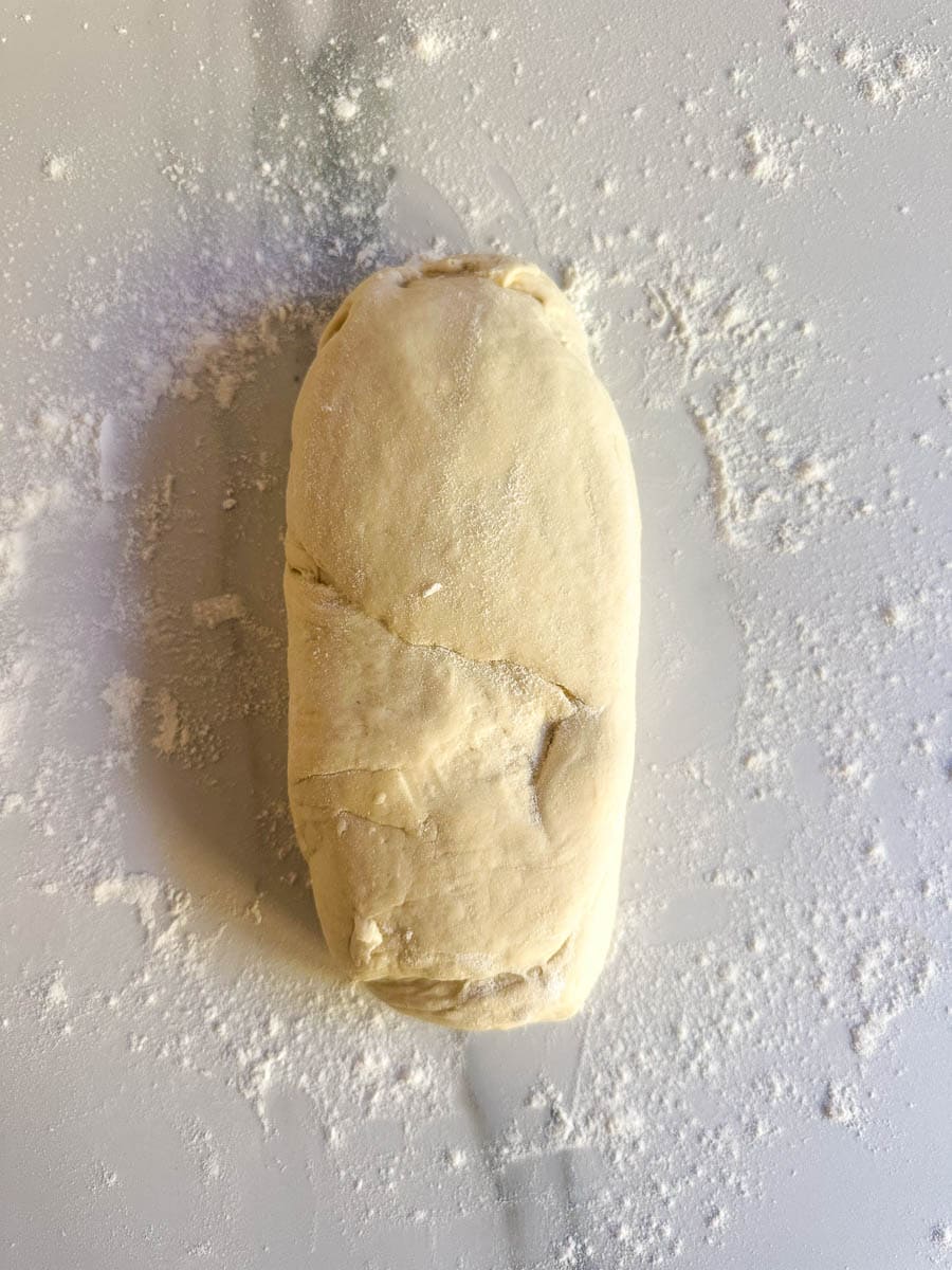 Bread dough shaped into a log shape.