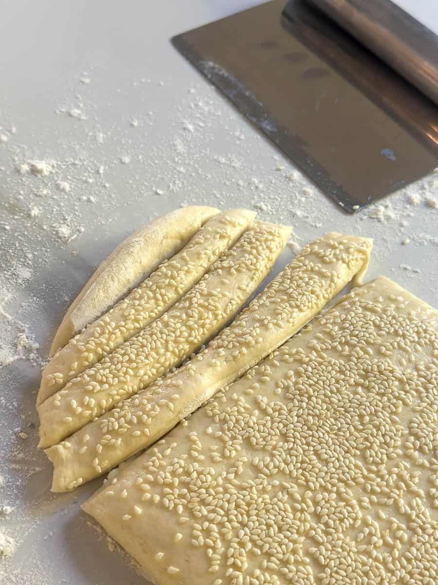 Cutting strips from the Grissini dough. 