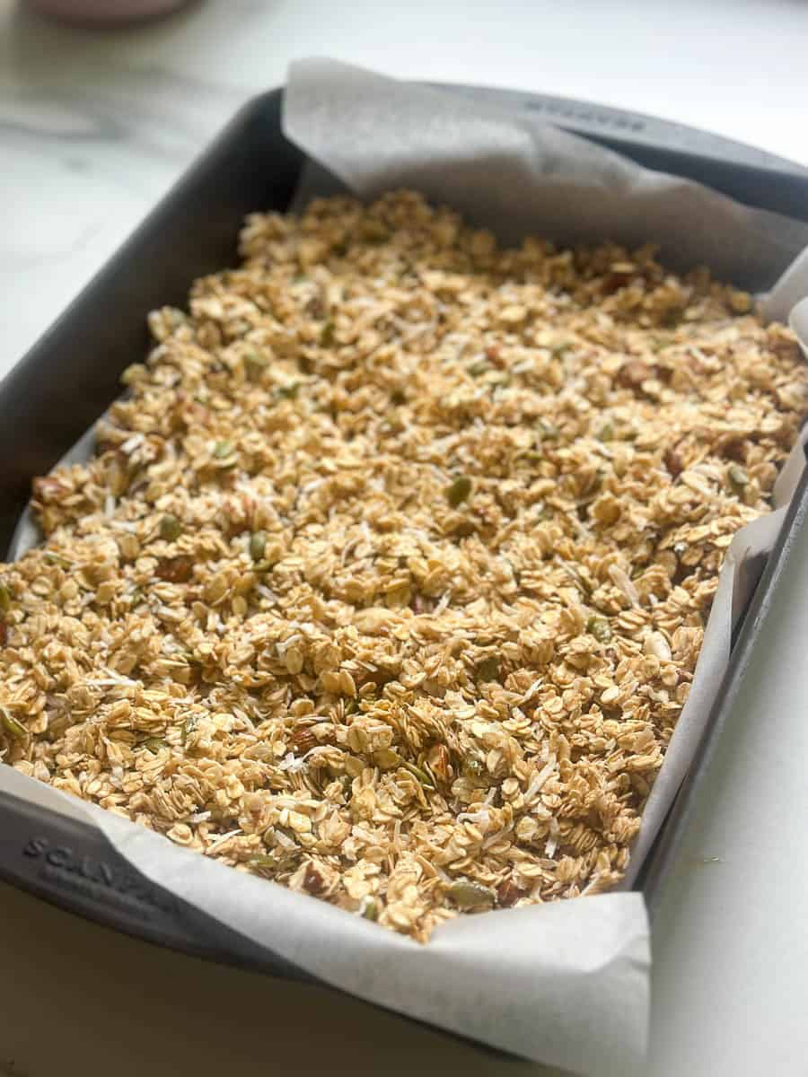 Granola in a baking tray.