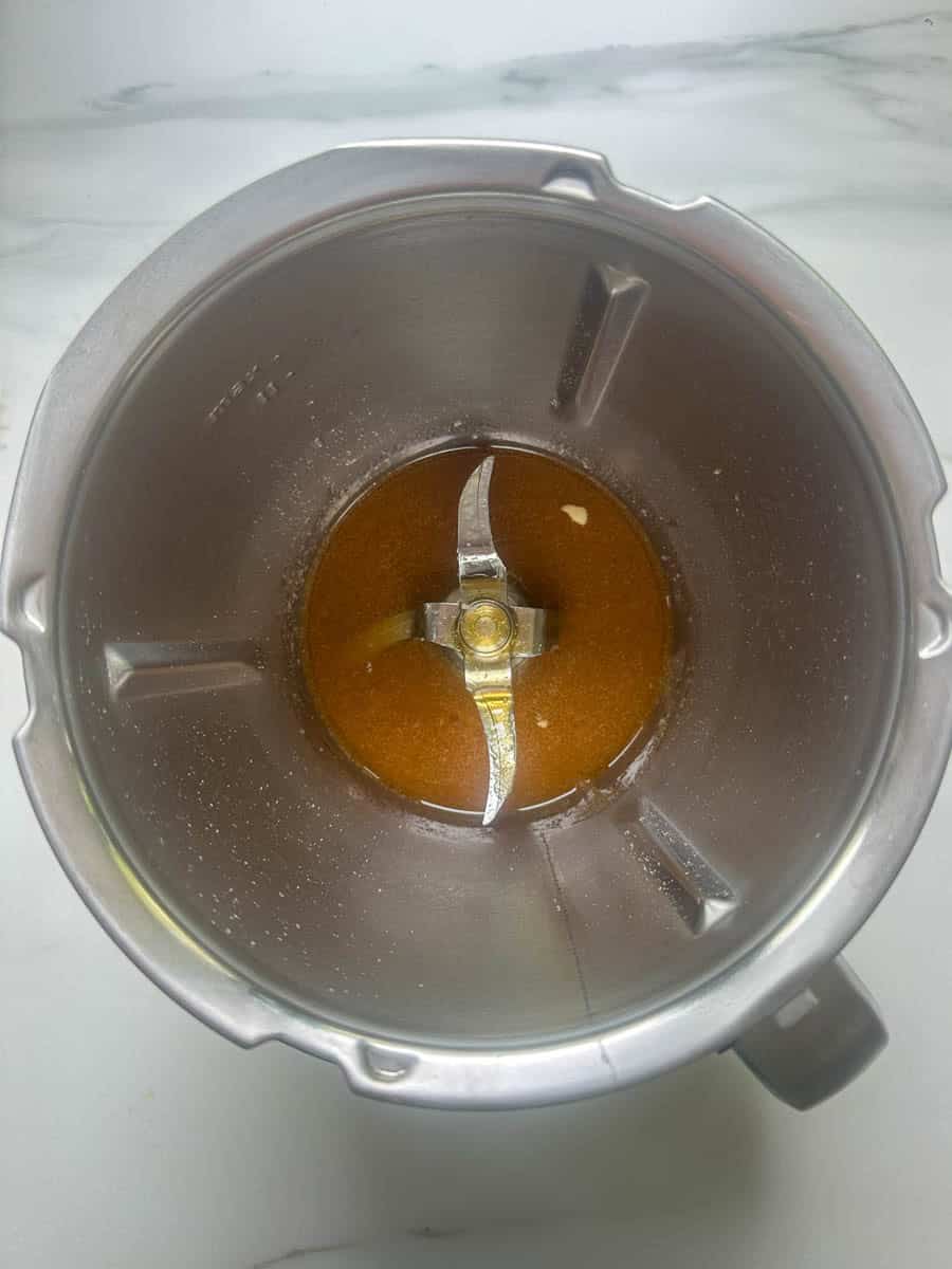 Melted coconut oil, maple syrup and honey in the Thermomix bowl.