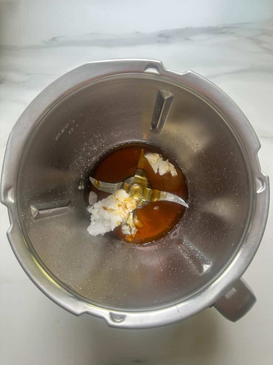 Coconut oil, maple syrup and honey in the Thermomix bowl.