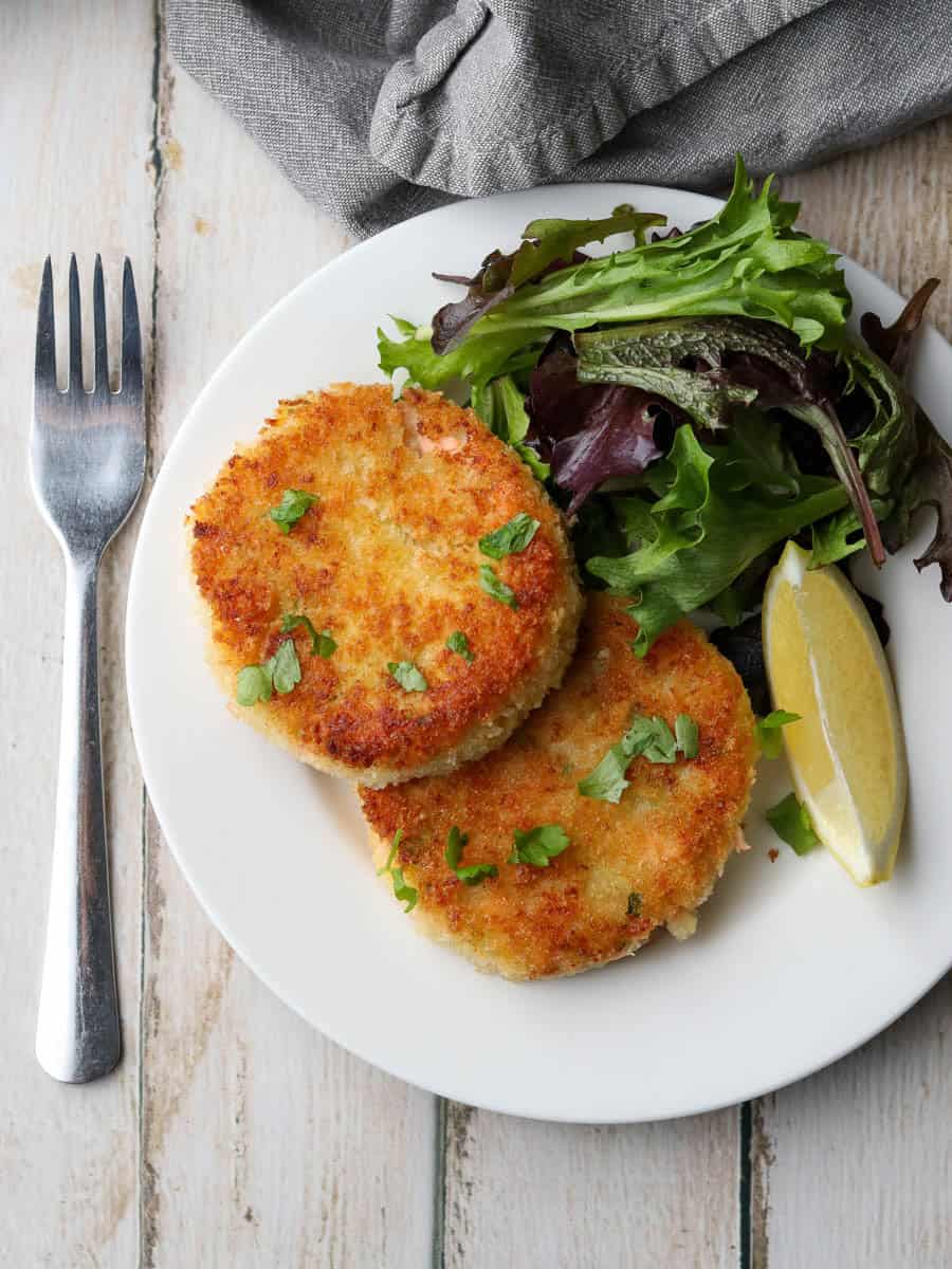 Thermomix Salmon Fishcakes served on a plate with salad.