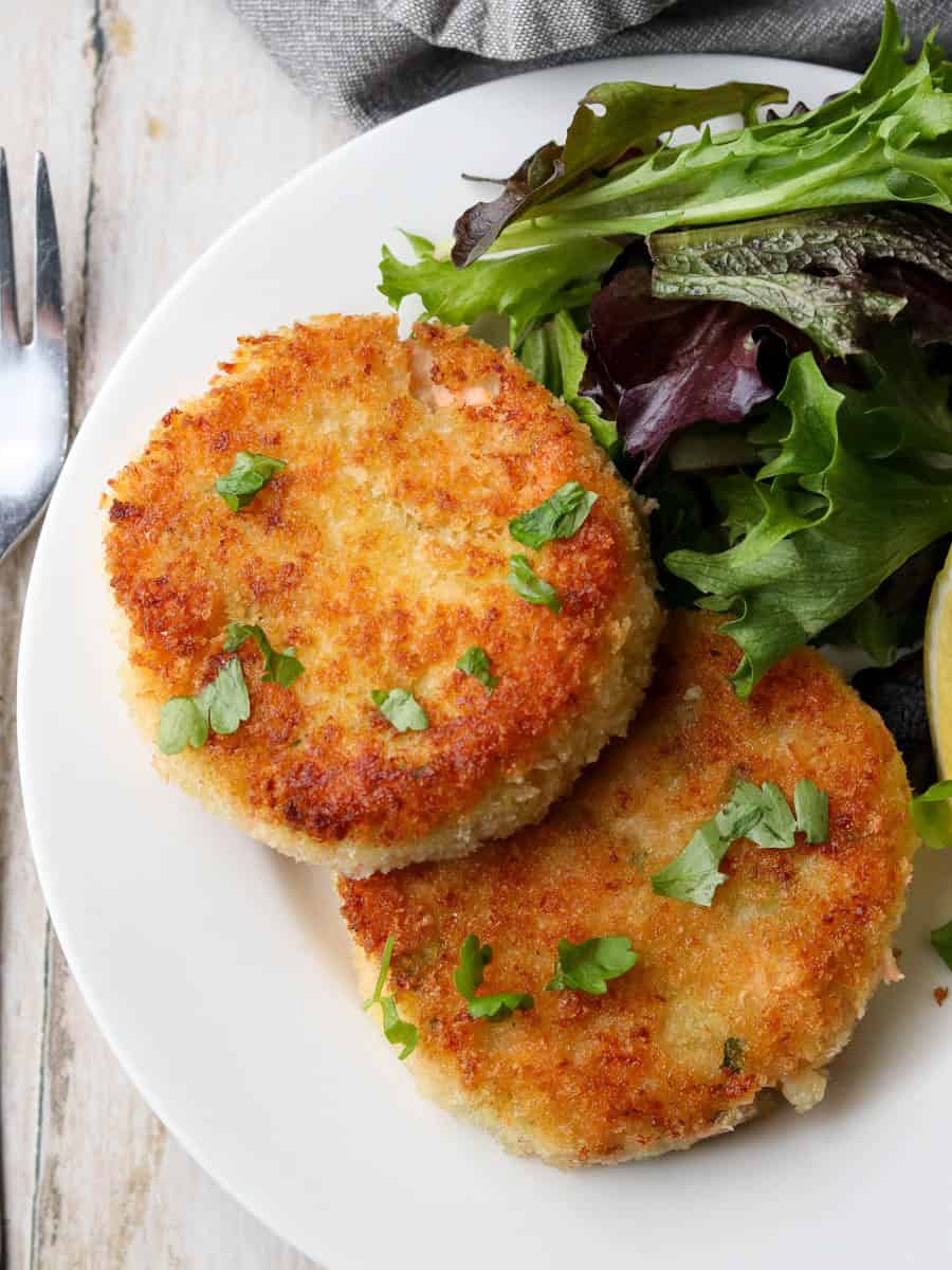 Thermomix Salmon Fishcakes served on a plate with salad.