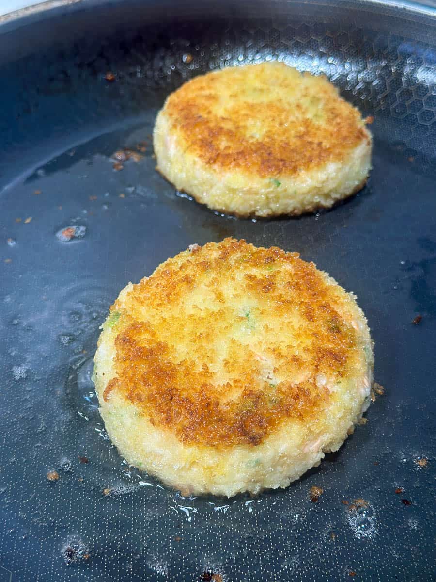 Shallow frying salmon fishcakes.