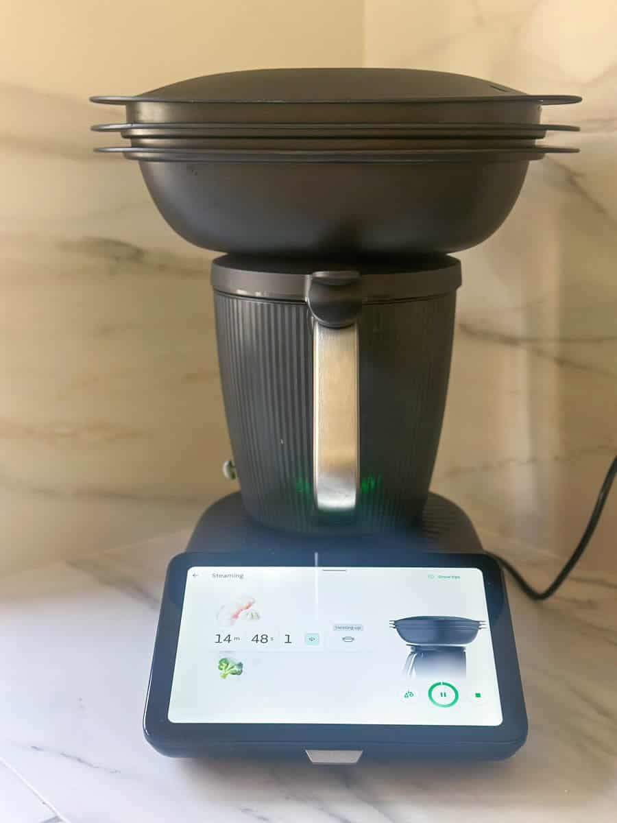 Thermomix machine with Varoma tray in place and steaming mode activated.