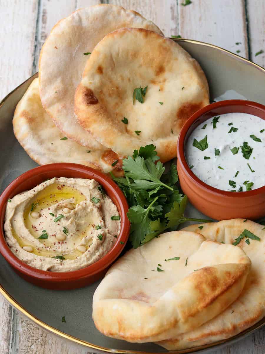 Air fryer flatbreads on a plate with dips.