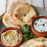 Air fryer flatbreads on a plate with dips.