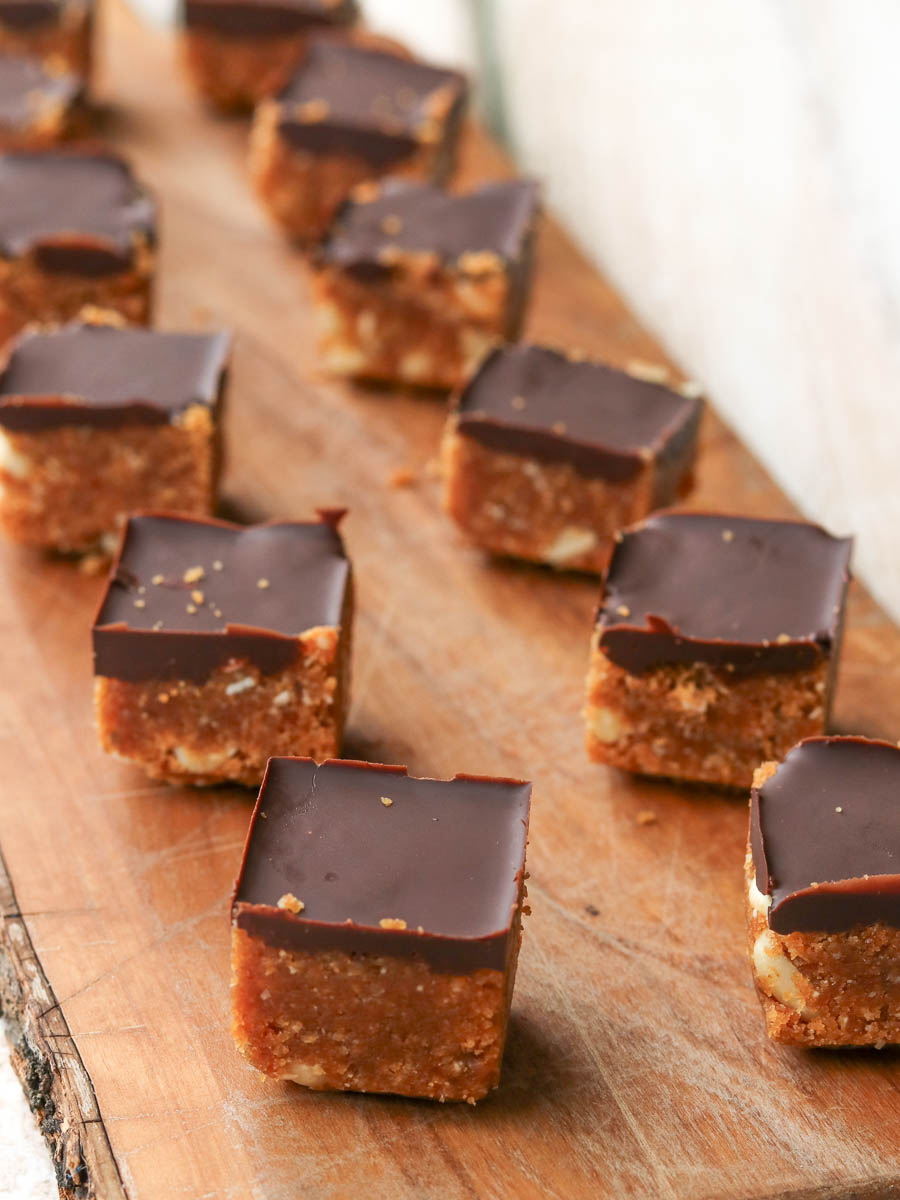 Thermomix Peanut Butter Chocolate Energy Bites laid out on a board.