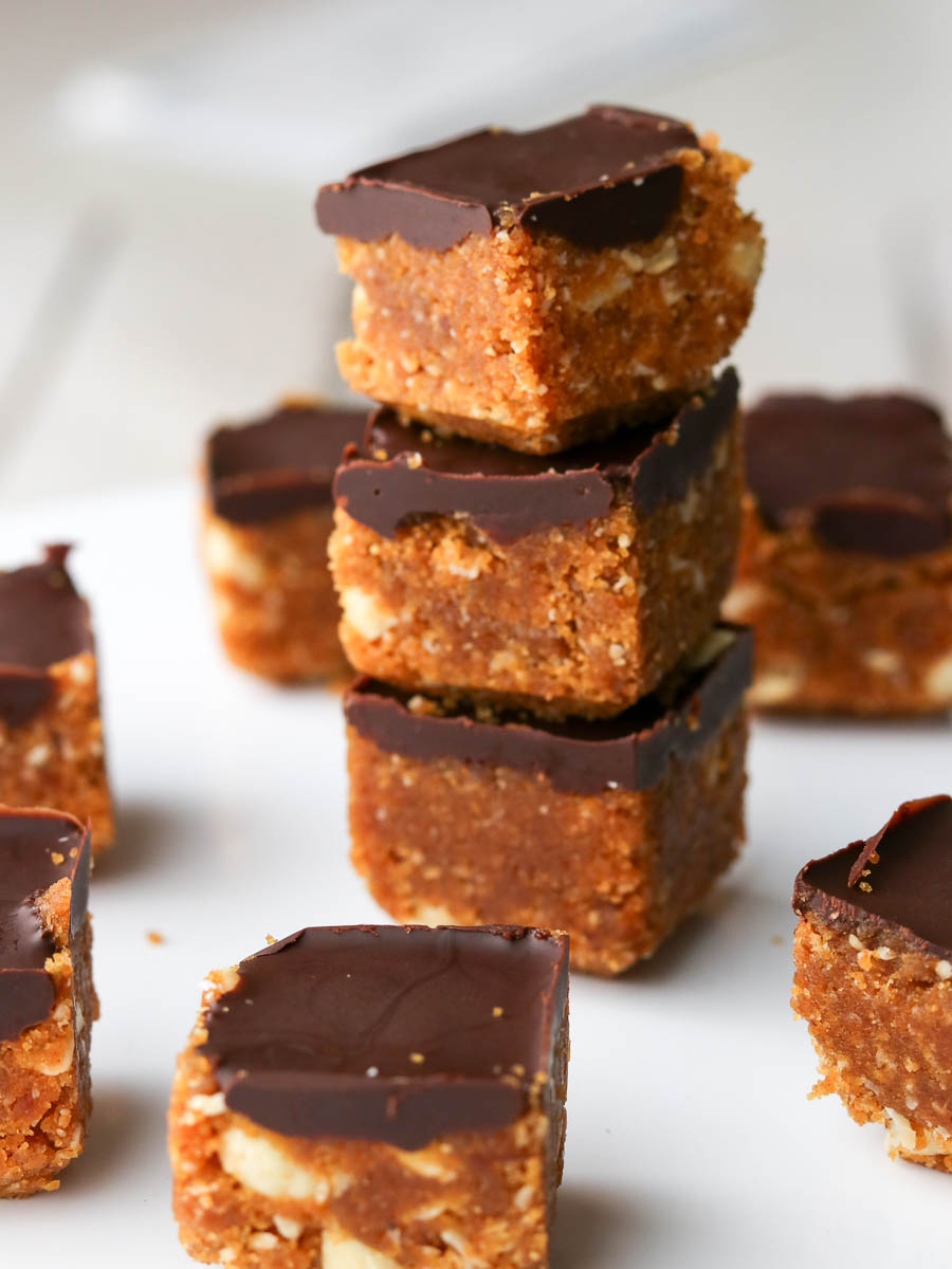 Thermomix Peanut Butter Chocolate Energy Bites stacked on a plate.